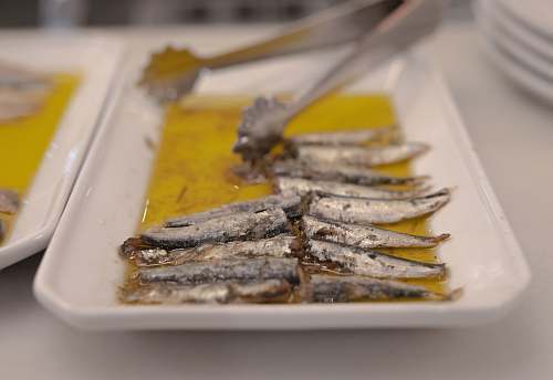 herring sardines in white serving platter fish